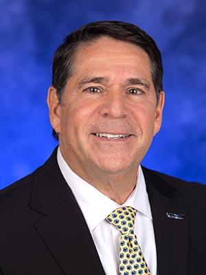 Don McKenna pictured in a professional head and shoulders photograph.