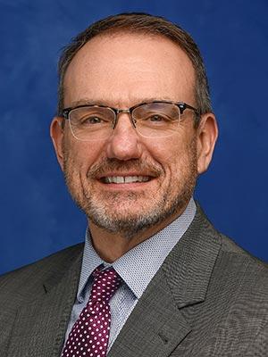 Randy Morris is pictured in a professional head and shoulders photo.