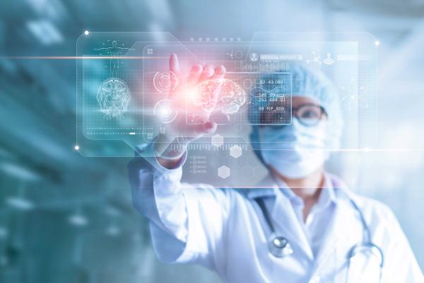 Doctor, surgeon analyzing patient brain testing result and human anatomy on technological digital futuristic virtual computer interface, digital holographic, innovative in science and medicine concept 